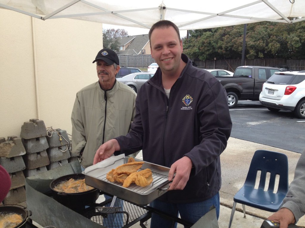 Grand Knight Nick Kleinhaus ably demonstrated his skills as a "runner" delivering dozens of catfish fillets to the serving tables on the fourth Friday of Lent.