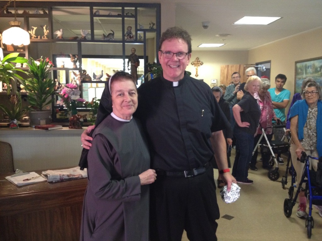 Director Sr. Carolina Sanchez Botero, and Fr. Mike Dugan of St. Elizabeth of Hungary in Dallas.