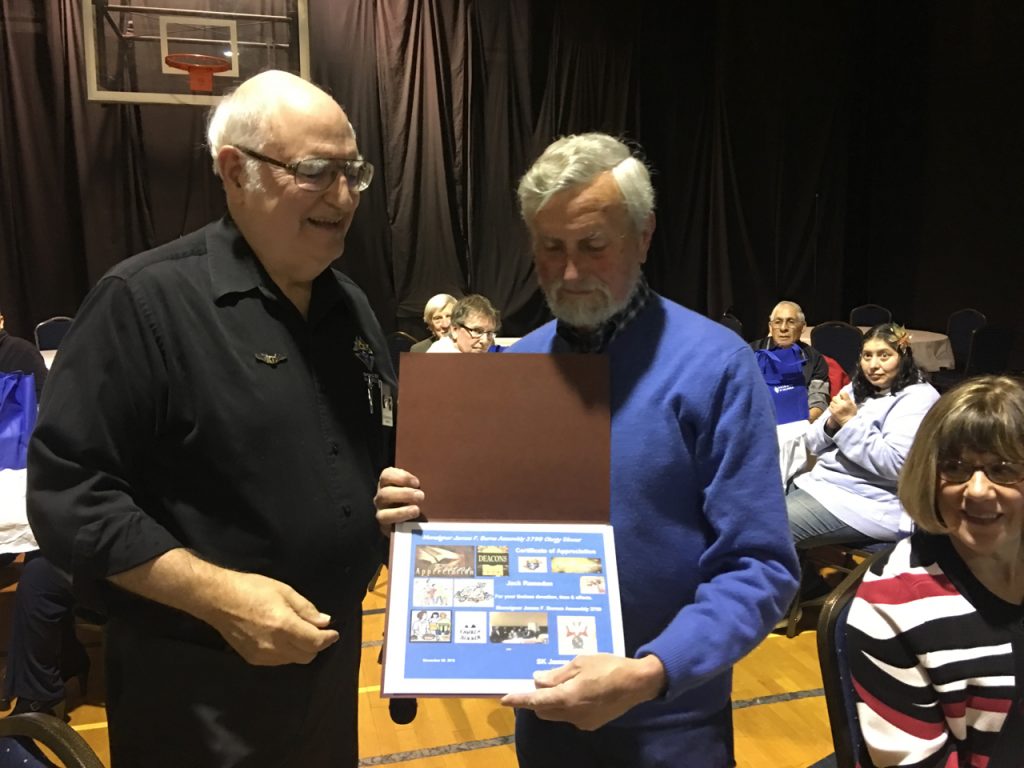 Jack Ramsden receiving certificate of appreciation from FN Jim Russell.