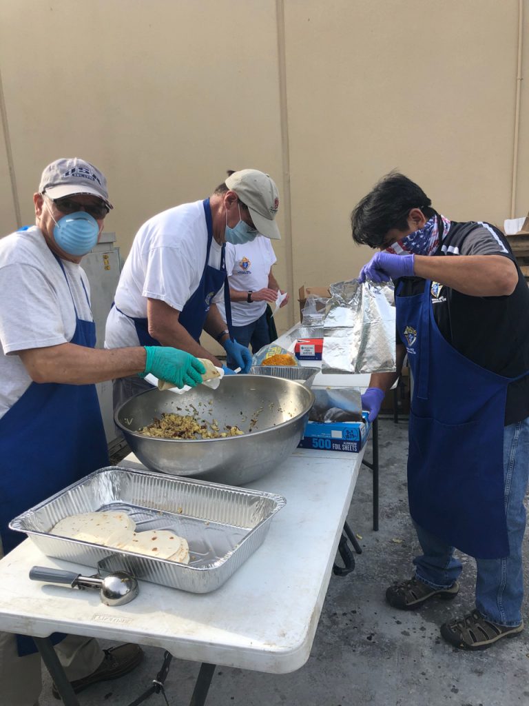 Knights prepare breakfast tacos for EMTs
